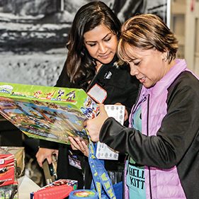 Two woman looking at toys