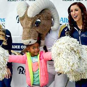 kid with Rams mascot